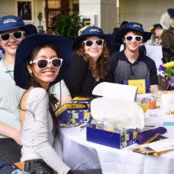 Three 网赌论坛有哪些 sophomores posed together while wearing 网赌论坛有哪些 hats. 